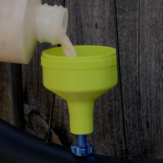 Sealant Funnel for filling tubeless bicycle tires with tire sealant.  Alternative to tire sealant injector.